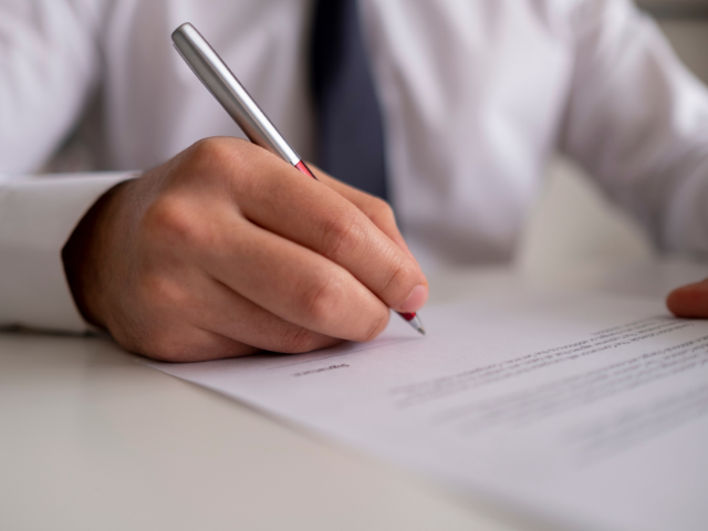 signing a paper